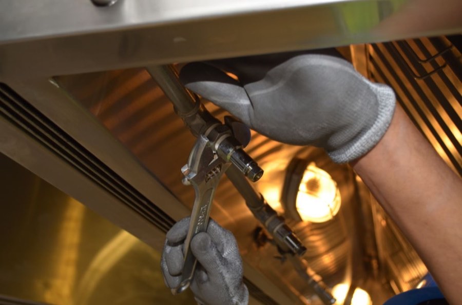Tightening pipe with spanner